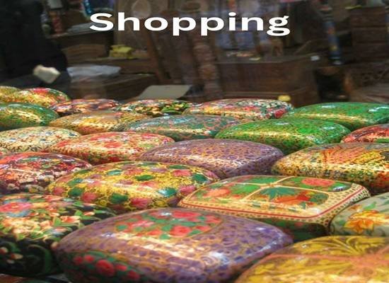 Kashmiri handicrafts and pashmina shawls displayed in a market